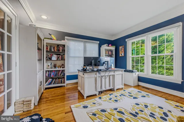 a spacious bedroom with a bed and a cabinets