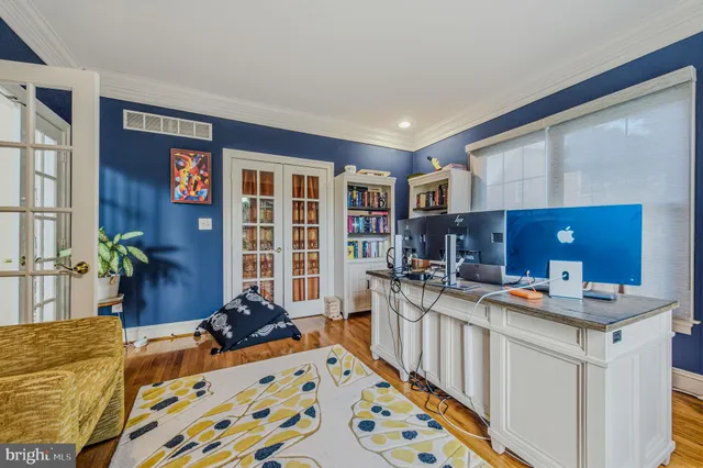 a bedroom with a bed window and a dresser