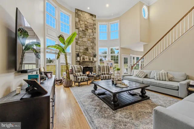 a living room with furniture rug and window