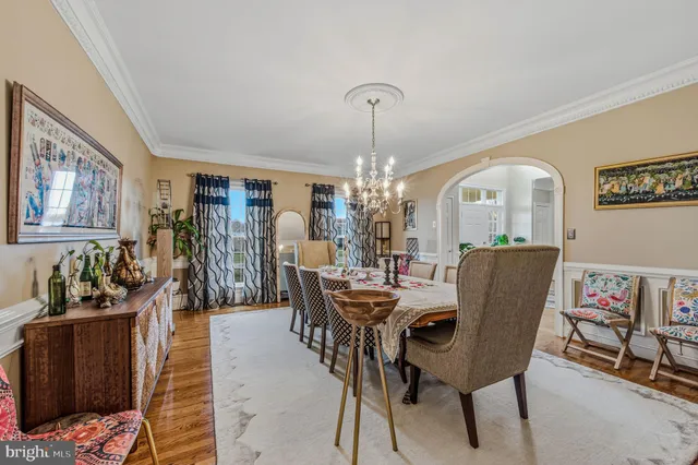 a living room with furniture rug and wooden floor