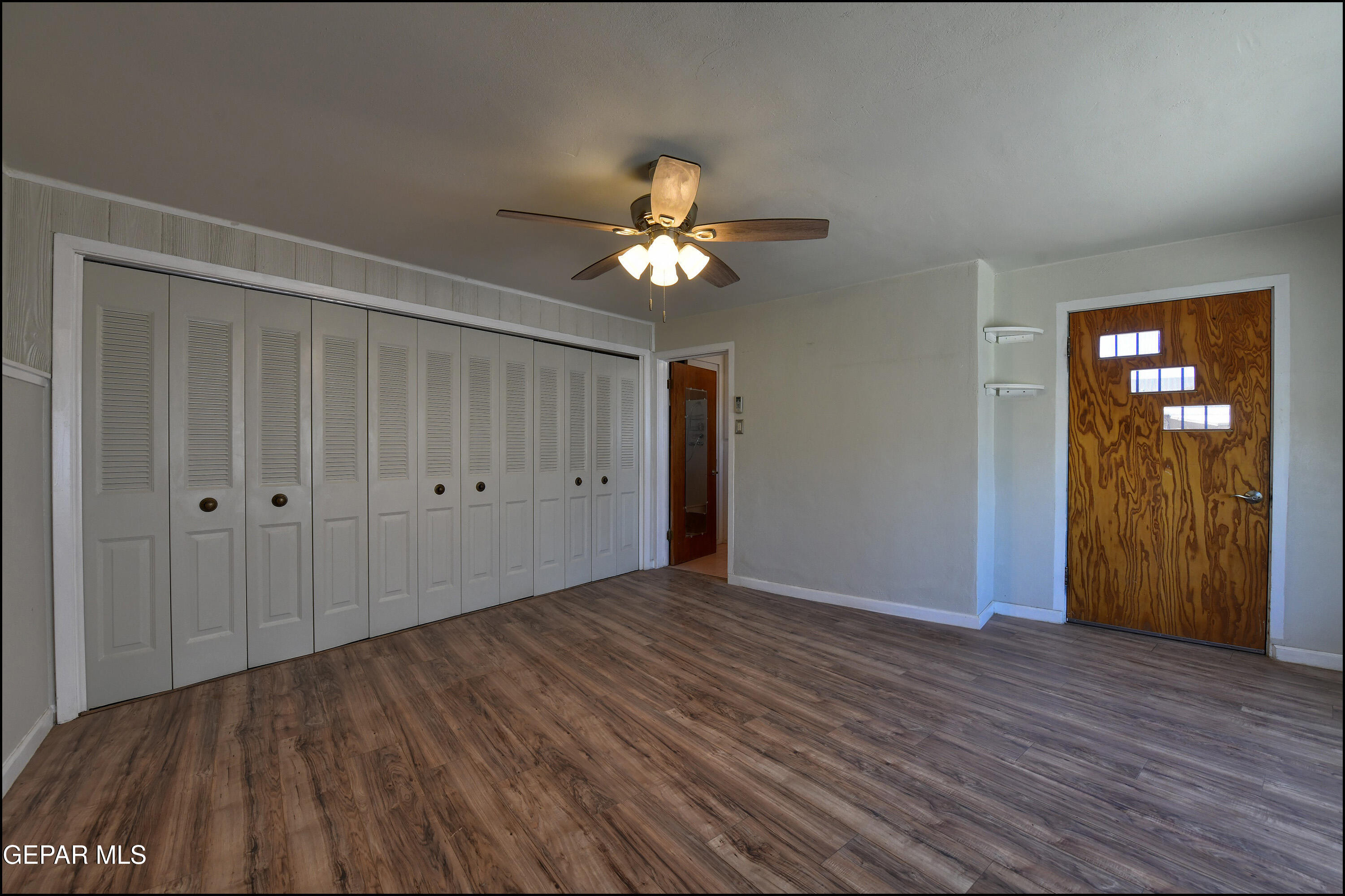 5107 Raymond Jays Road El Paso, TX 79903 - Photo 18 of 35 a view of empty room with wooden floor