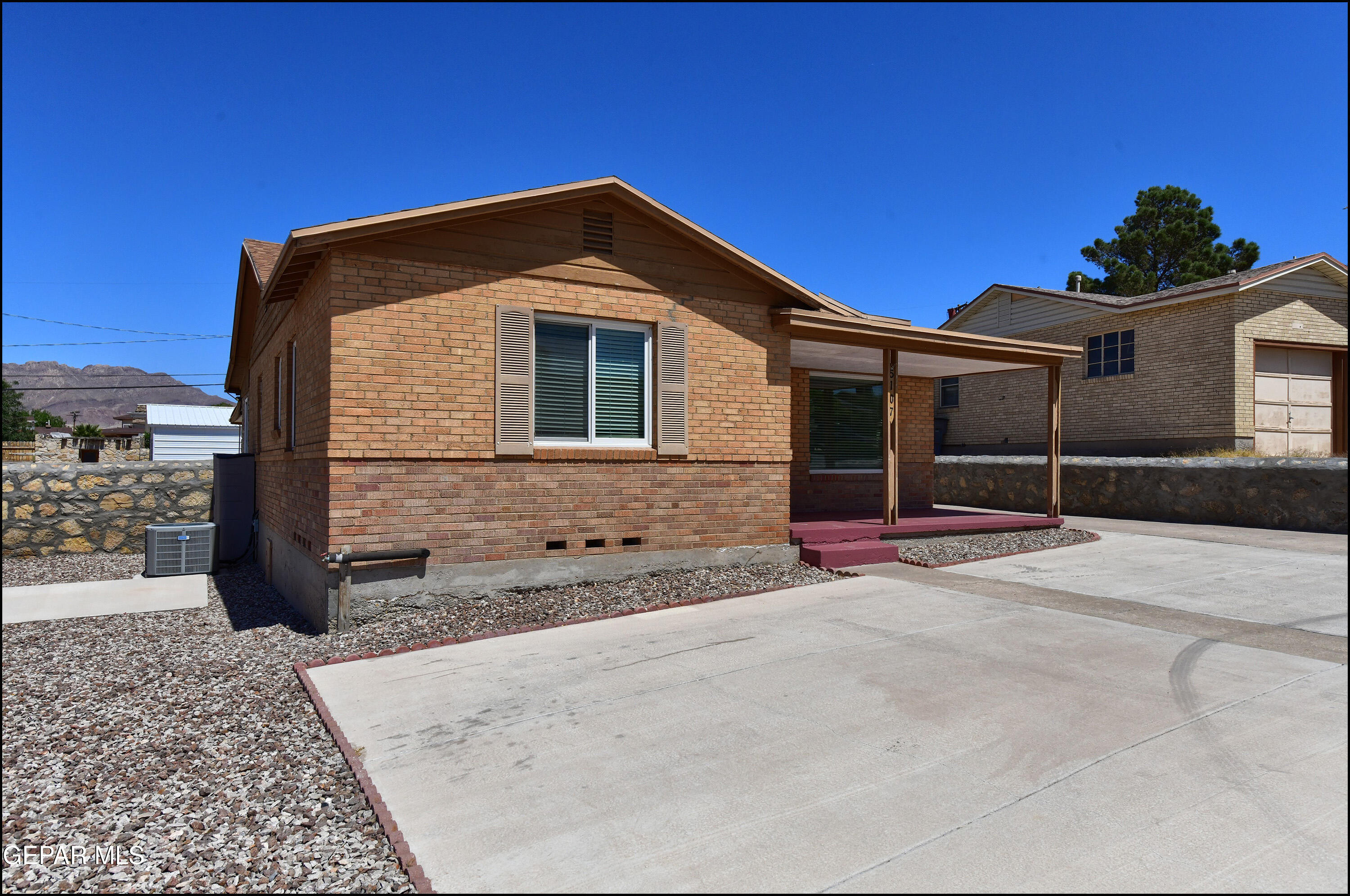 5107 Raymond Jays Road El Paso, TX 79903 - Photo 4 of 35 a front view of a house with a yard