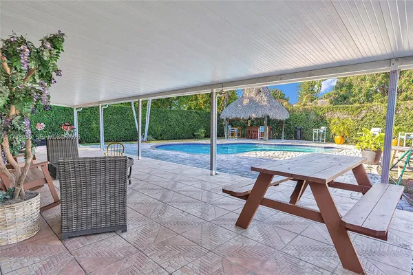 a balcony with furniture and garden view