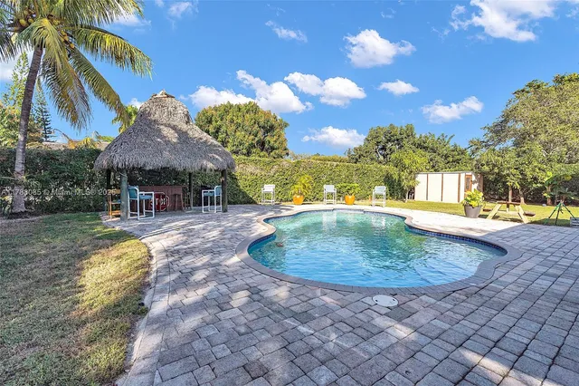 a view of a swimming pool with a patio