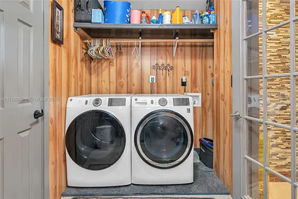 a utility room with dryer and washer