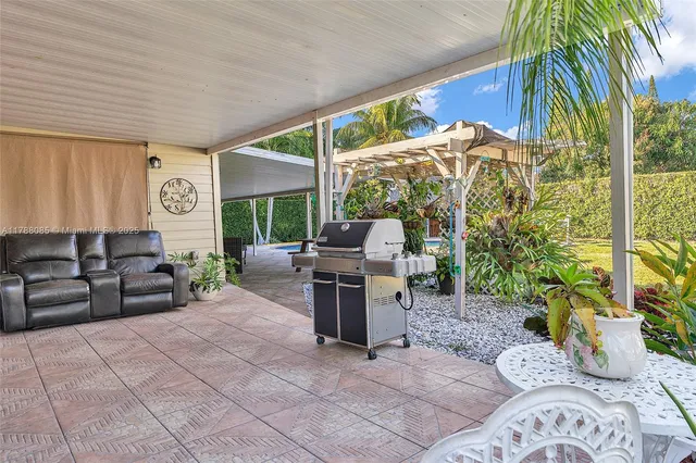 a kitchen with stainless steel appliances granite countertop a sink and a stove