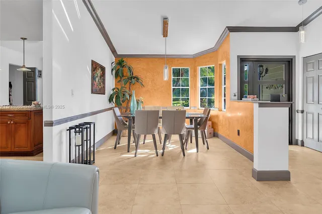 a view of a dining room with furniture window and outside view