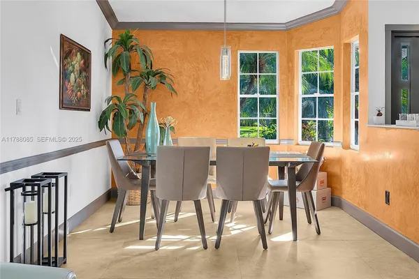 a dining room with furniture and window