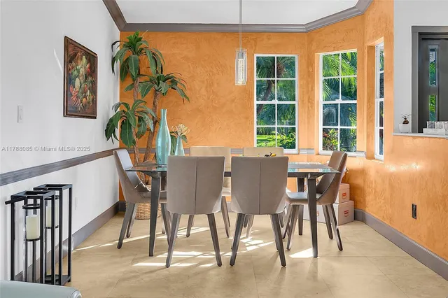 a dining room with furniture and window