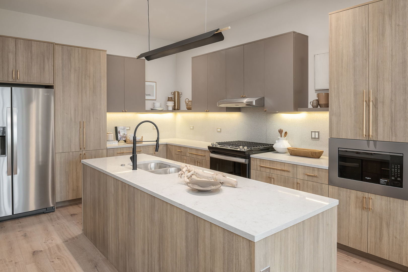 8020 O Connor Drive, Unit 214 River Grove, IL 60171 - Photo 7 of 52 a kitchen with stainless steel appliances a sink a stove a refrigerator and cabinets