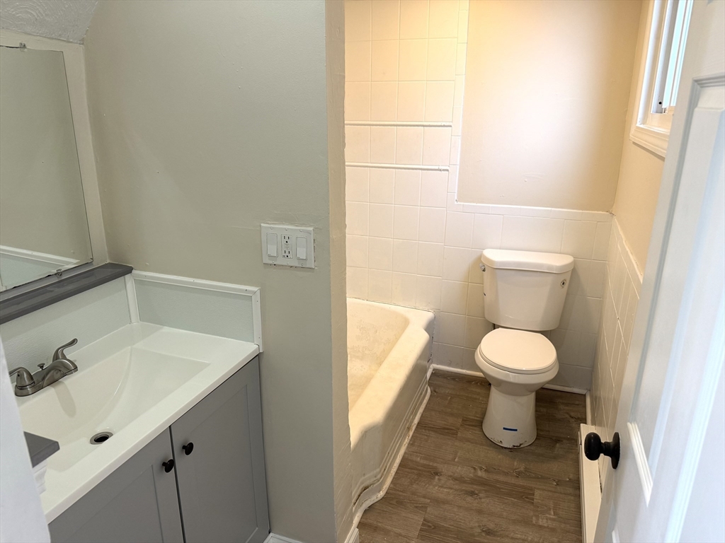 230 Pleasant Street Worcester, MA 01609 - Photo 12 of 23 a bathroom with a sink and a toilet