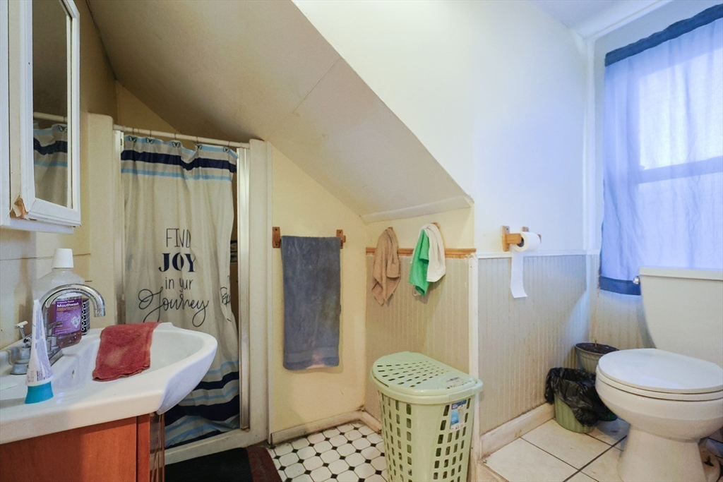 230 Pleasant Street Worcester, MA 01609 - Photo 23 of 23 a bathroom with a sink toilet and shower