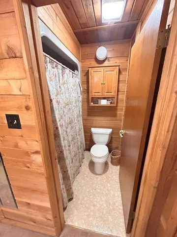 a bedroom with two large bed and a large window