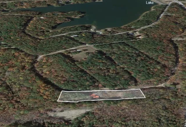 a view of a chairs and table in the balcony