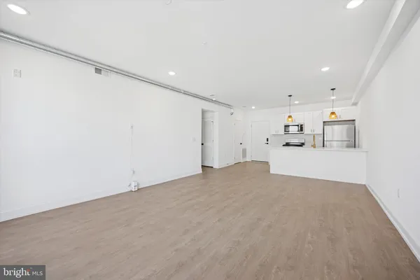 a view of a kitchen with a sink