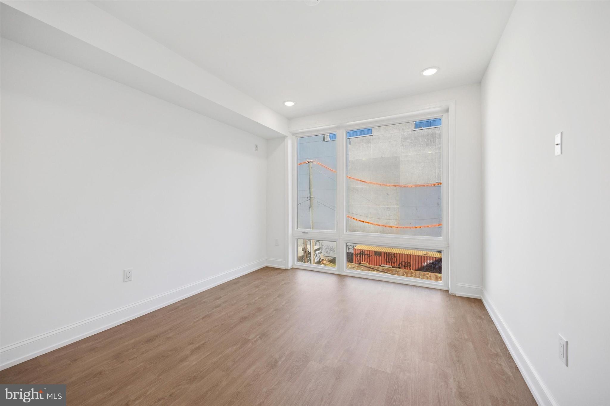 1614 Ridge Avenue, Unit 504 Philadelphia, PA 19130 - Photo 6 of 10 a view of an empty room with wooden floor