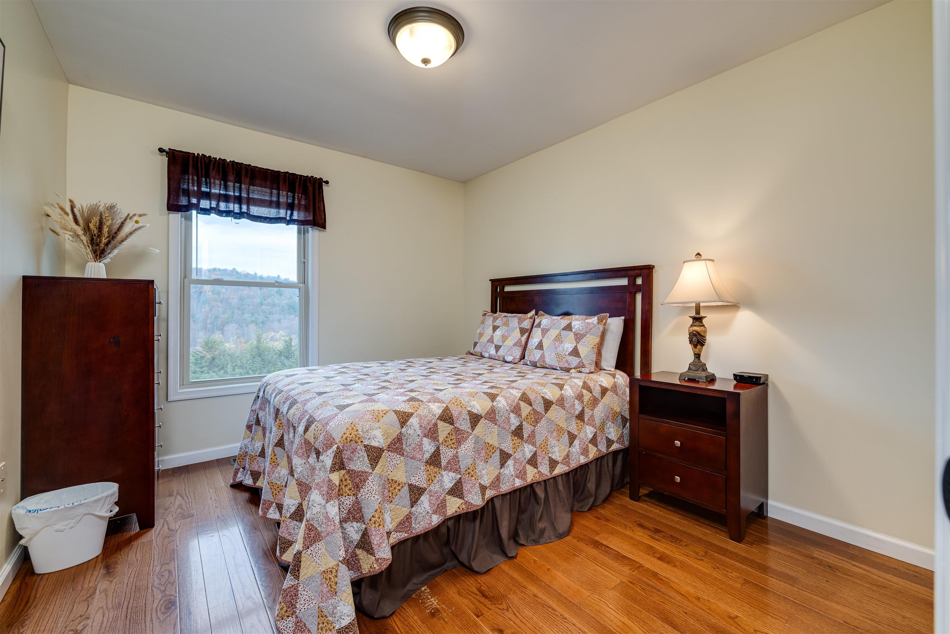2225-2319 Valley Burg Road Luray, VA 22835 - Photo 18 of 57 a bedroom with a bed and wooden floor