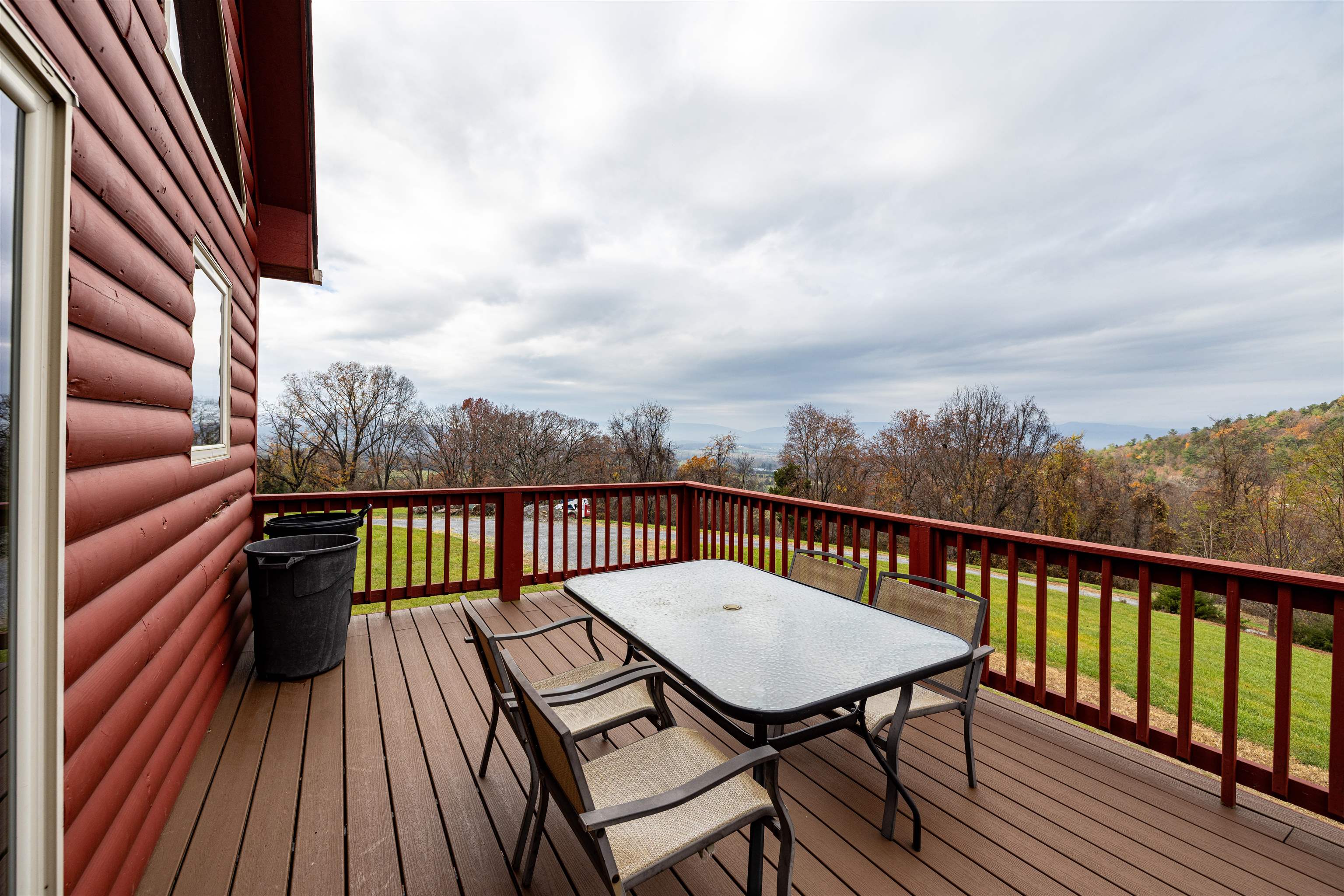 2225-2319 Valley Burg Road Luray, VA 22835 - Photo 31 of 57 a view of a balcony with wooden floor table and chairs