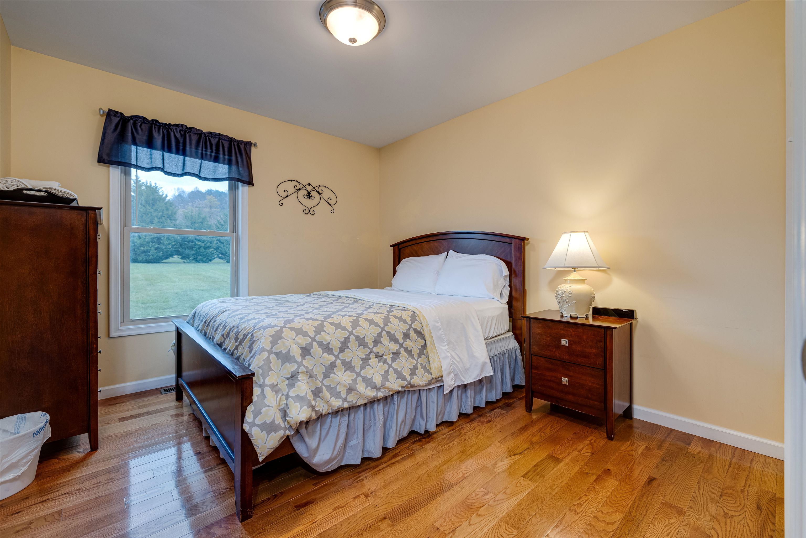2225-2319 Valley Burg Road Luray, VA 22835 - Photo 43 of 57 a bedroom with a bed and wooden floor