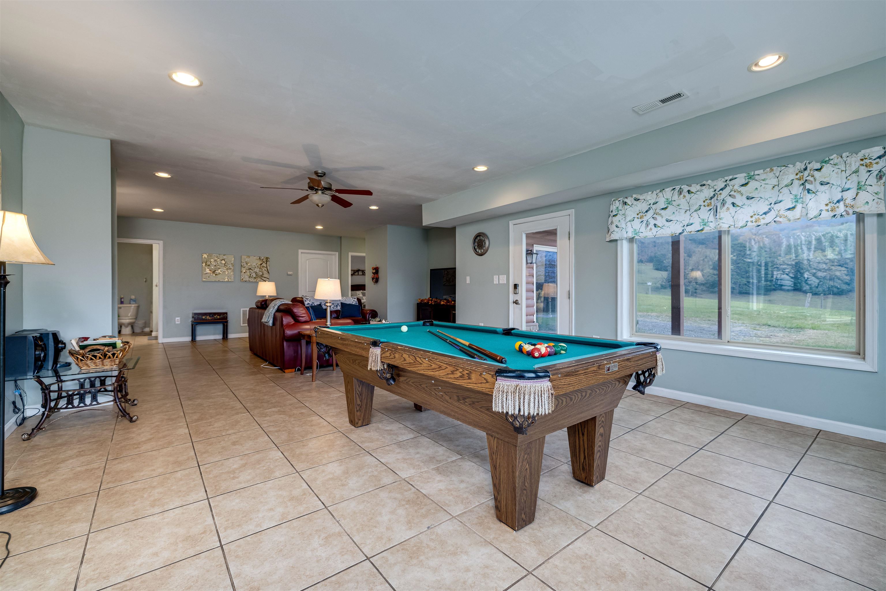 2225-2319 Valley Burg Road Luray, VA 22835 - Photo 47 of 57 a living room with furniture a table and a large window