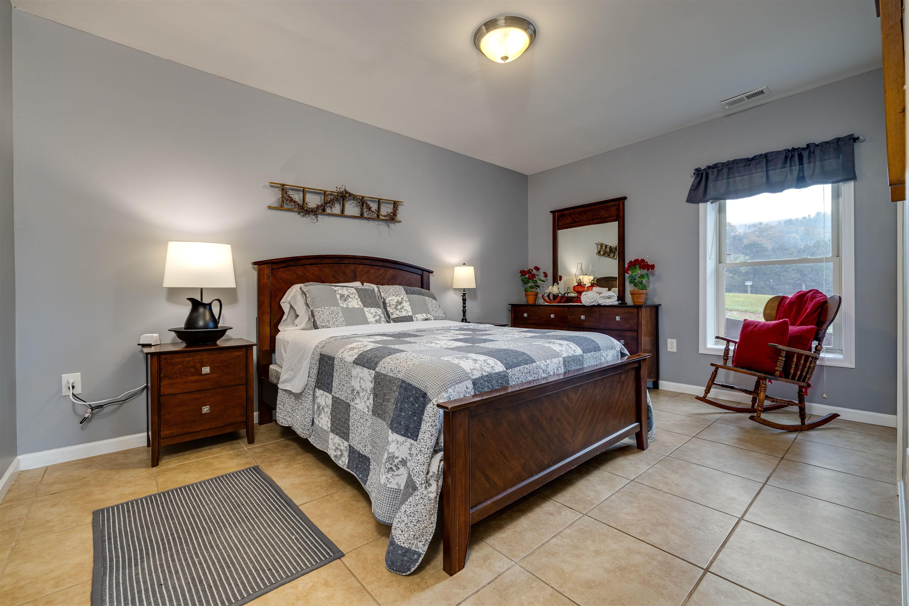 2225-2319 Valley Burg Road Luray, VA 22835 - Photo 51 of 57 a bedroom with a bed and window