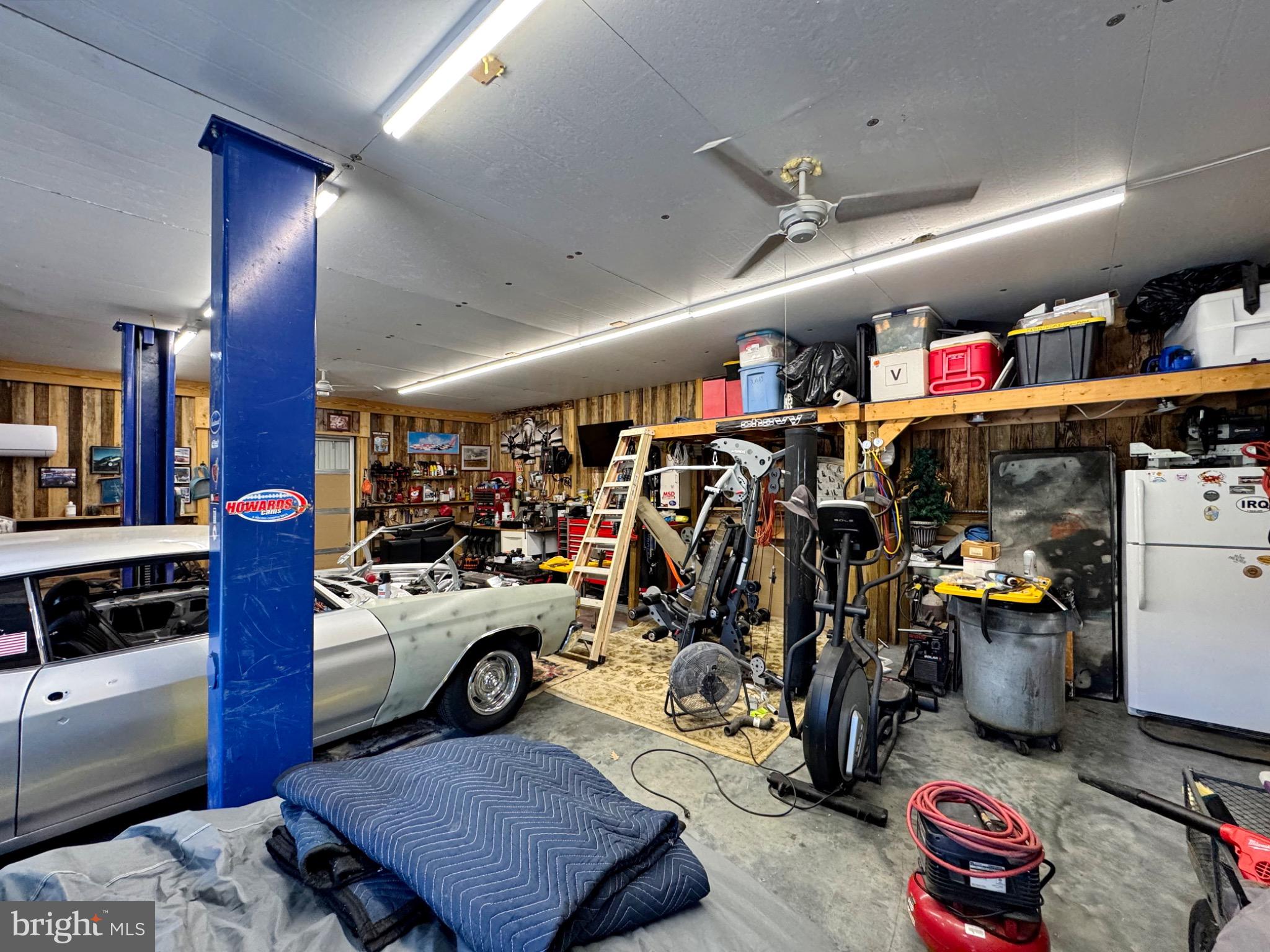 7406 Robin Road La Plata, MD 20646 - Photo 16 of 89 Spacious garage filled with tools and projects.