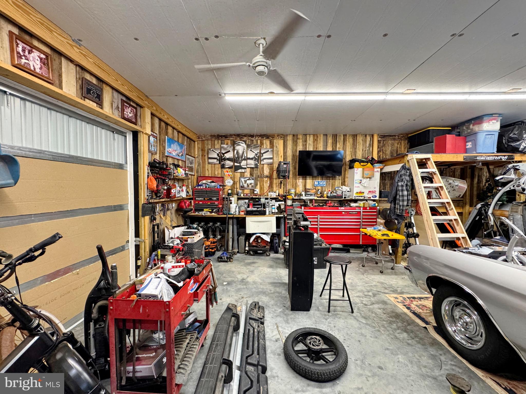 7406 Robin Road La Plata, MD 20646 - Photo 19 of 89 A bustling garage filled with tools and projects.