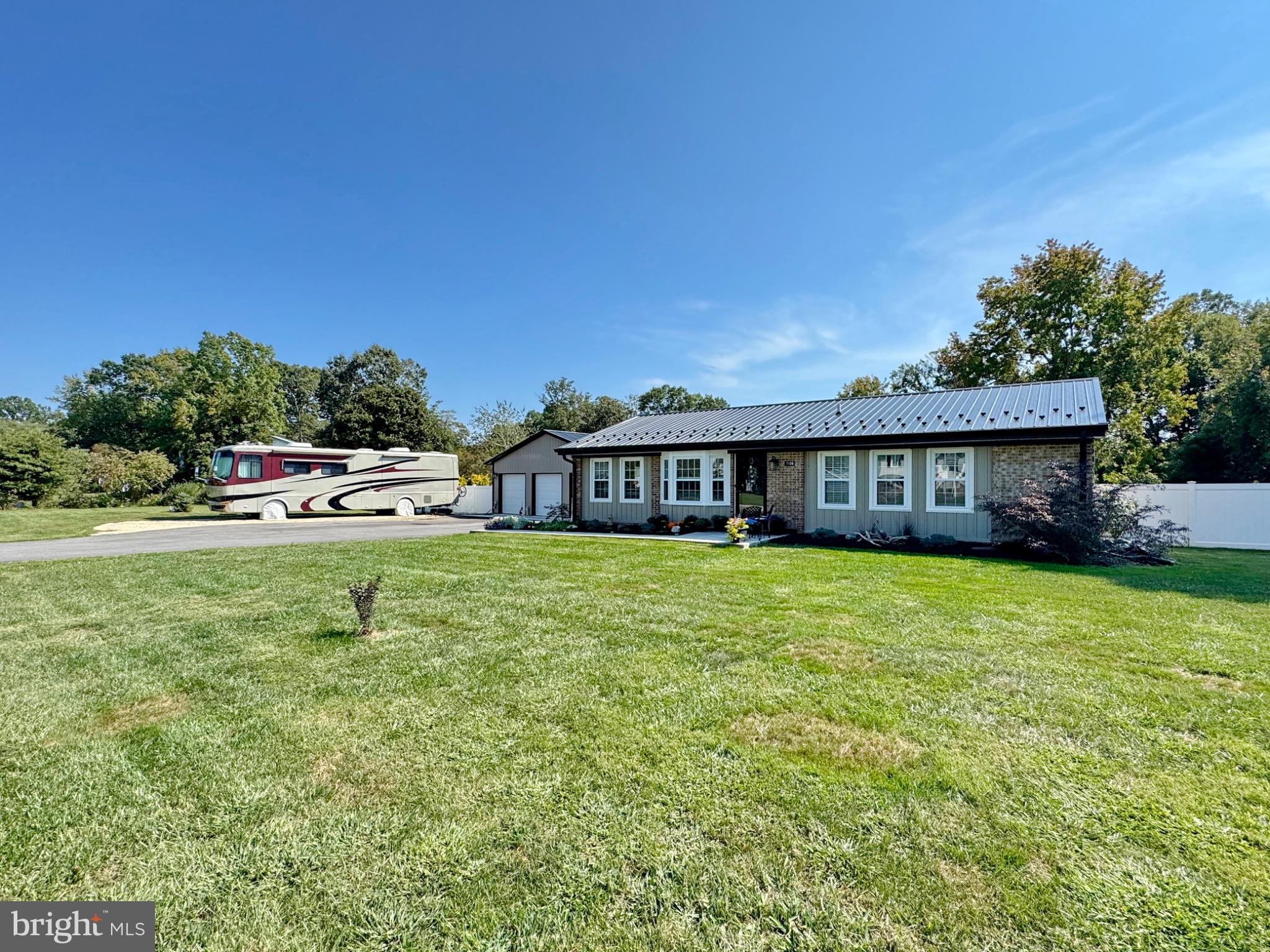 7406 Robin Road La Plata, MD 20646 - Photo 3 of 89 Charming home with lush green surroundings.