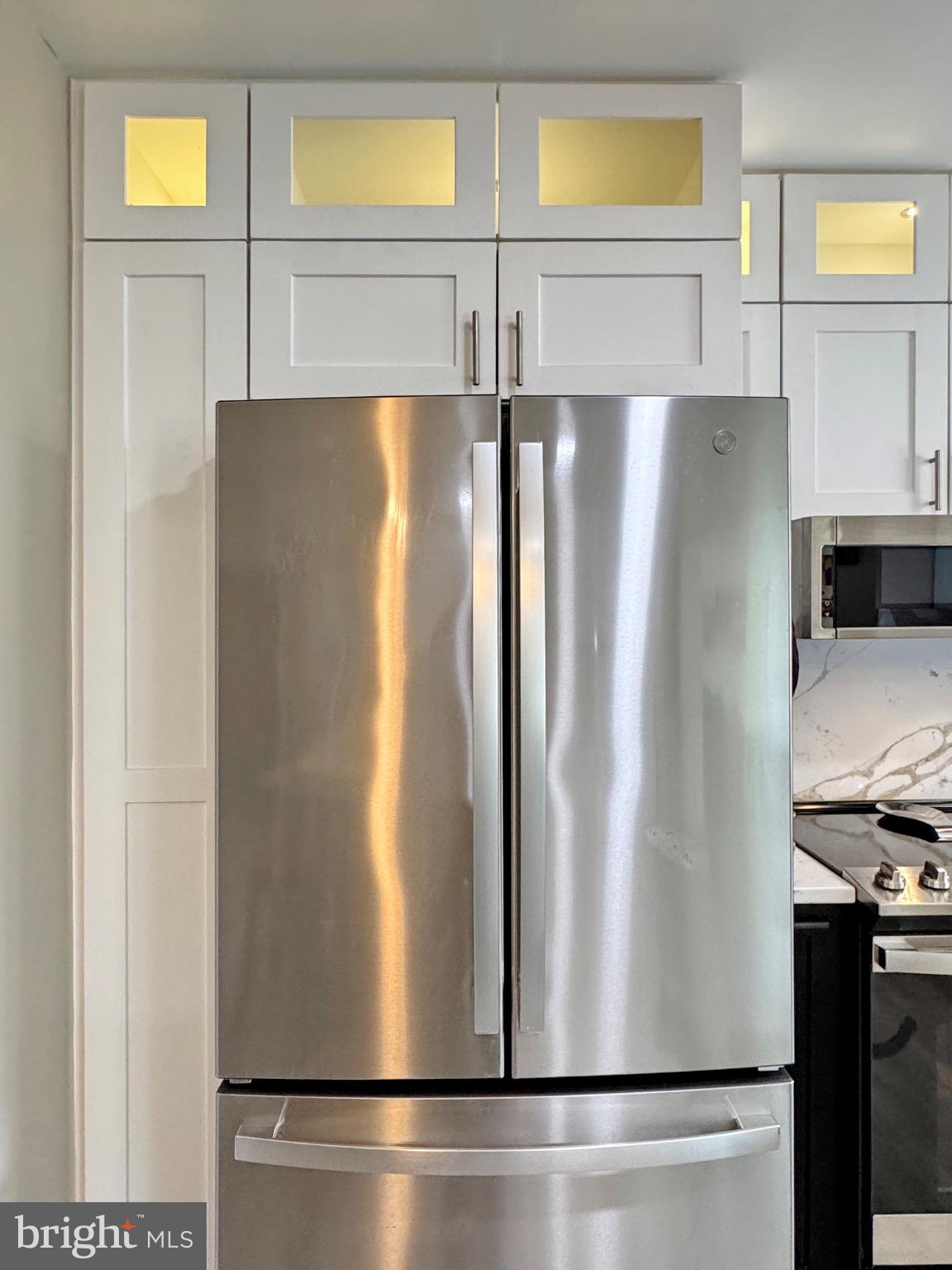 7406 Robin Road La Plata, MD 20646 - Photo 35 of 89 Sleek stainless steel fridge in modern kitchen.