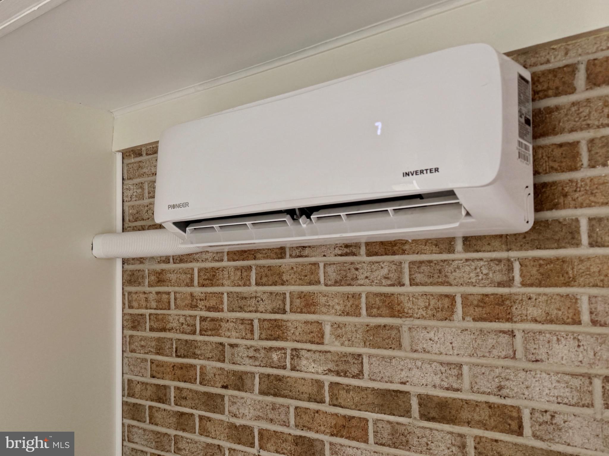 7406 Robin Road La Plata, MD 20646 - Photo 45 of 89 Sleek air conditioning unit on brick wall.