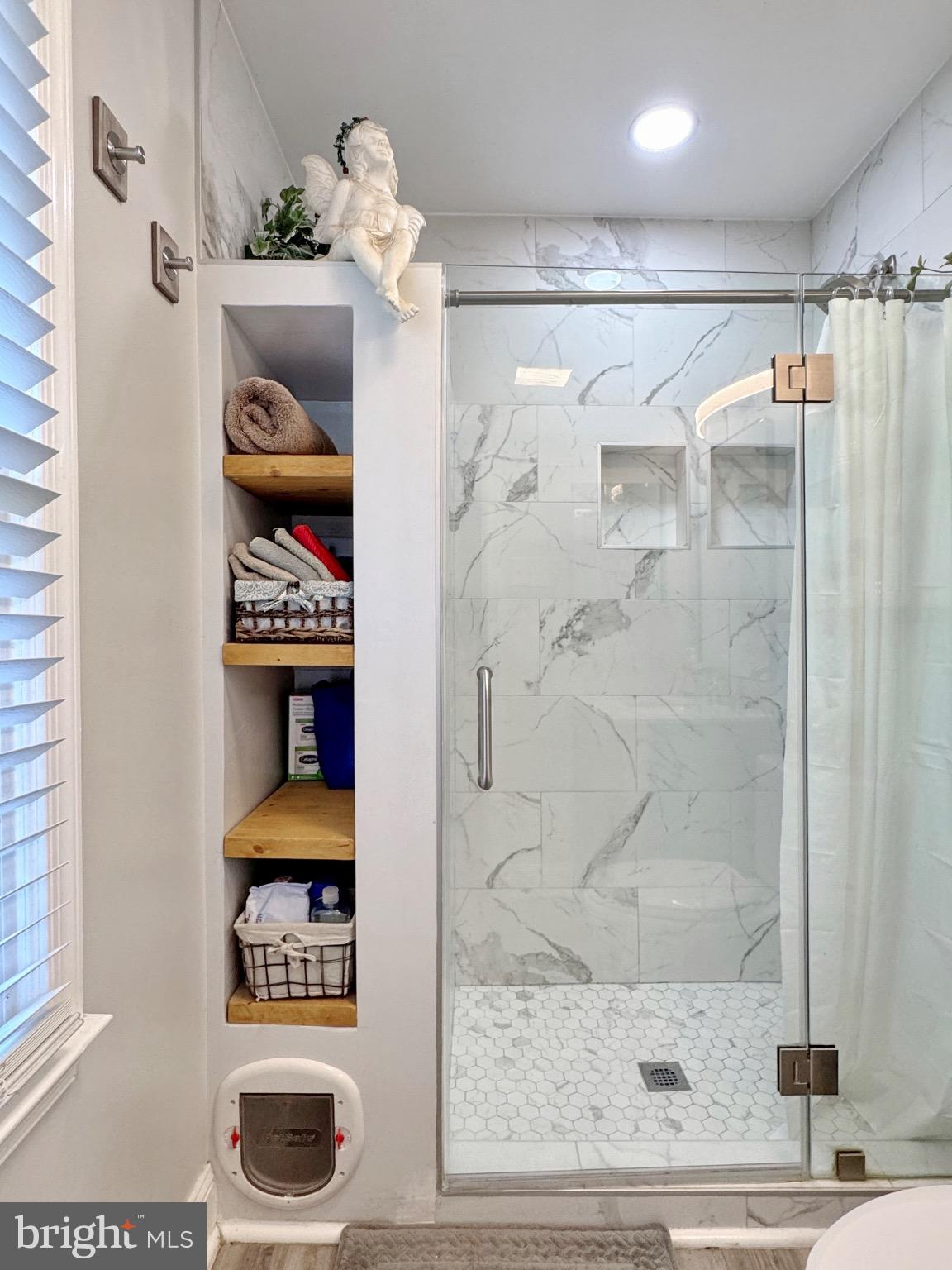 7406 Robin Road La Plata, MD 20646 - Photo 55 of 89 Modern bathroom with elegant glass shower.