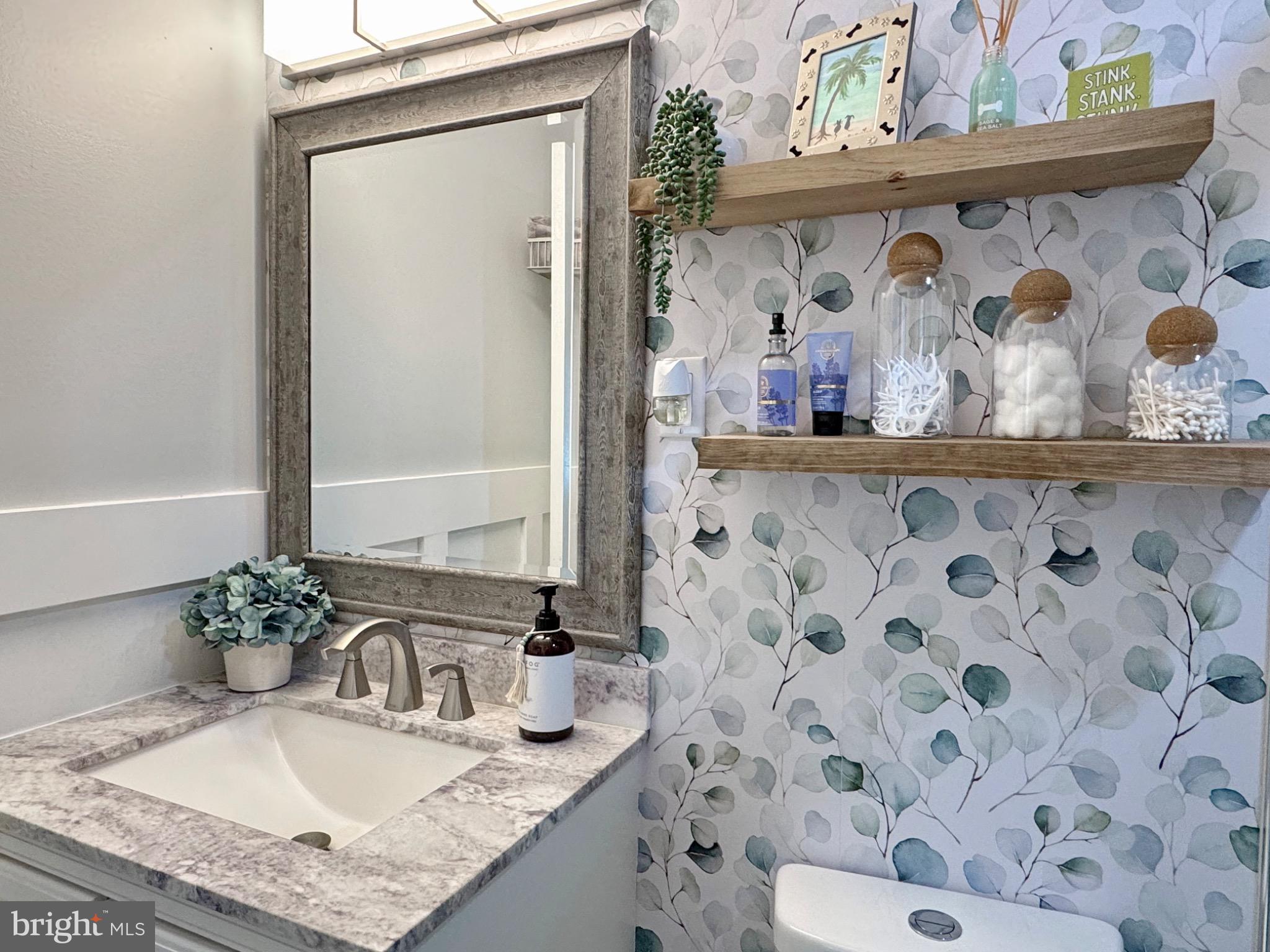 7406 Robin Road La Plata, MD 20646 - Photo 63 of 89 Charming bathroom with leafy wallpaper accents.