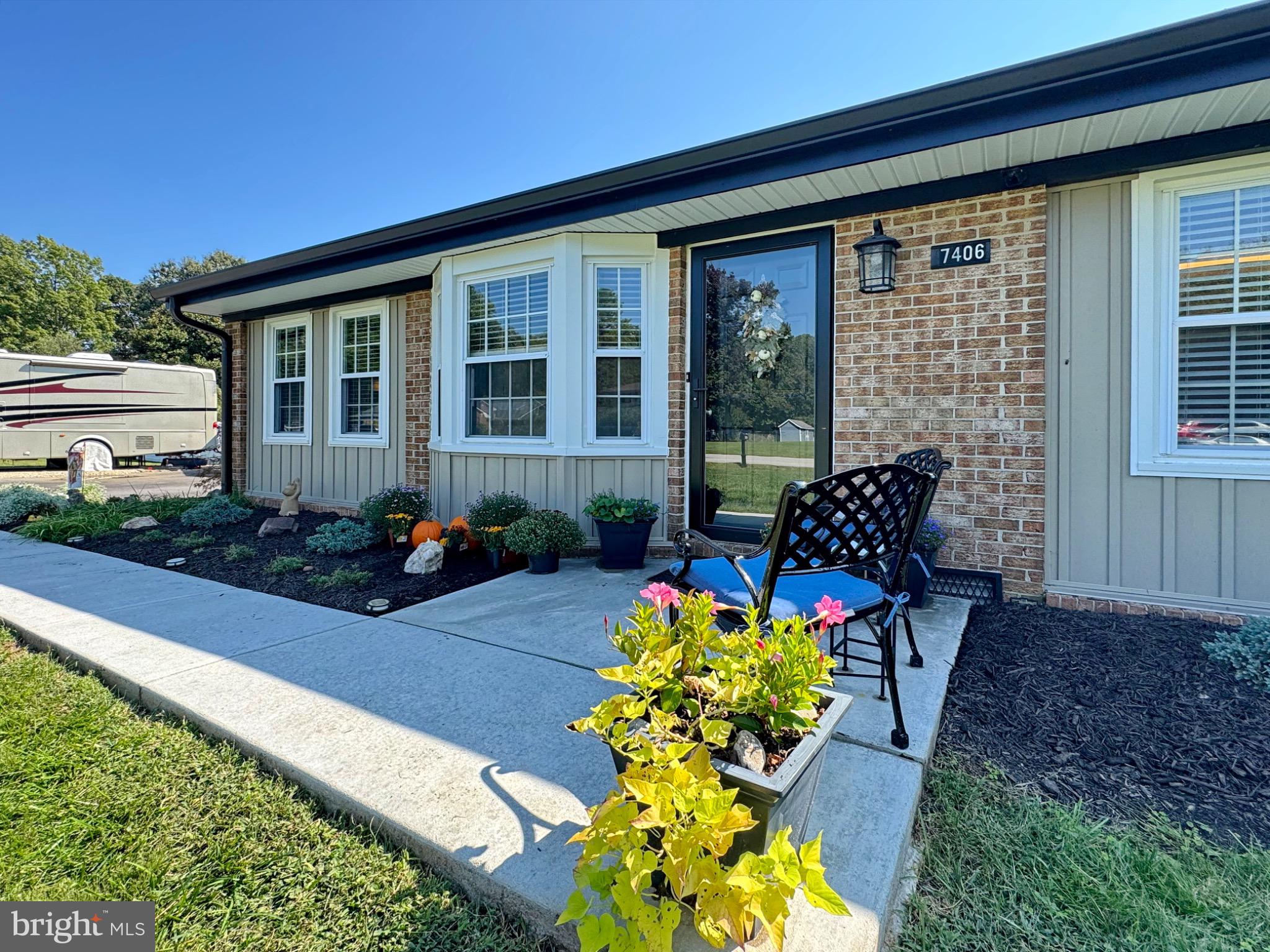 7406 Robin Road La Plata, MD 20646 - Photo 7 of 89 Charming entryway with vibrant landscaping.