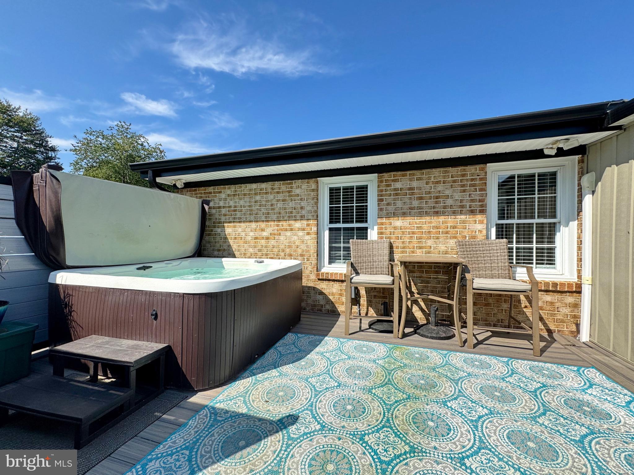 7406 Robin Road La Plata, MD 20646 - Photo 82 of 89 Charming patio with hot tub and serene vibes.
