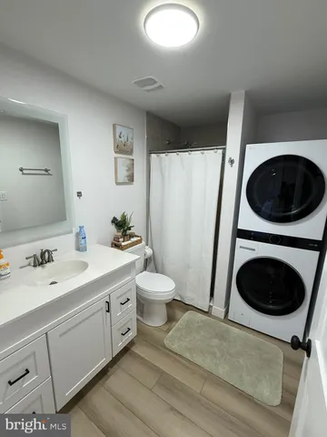 a spacious bathroom with a double vanity sink and a mirror