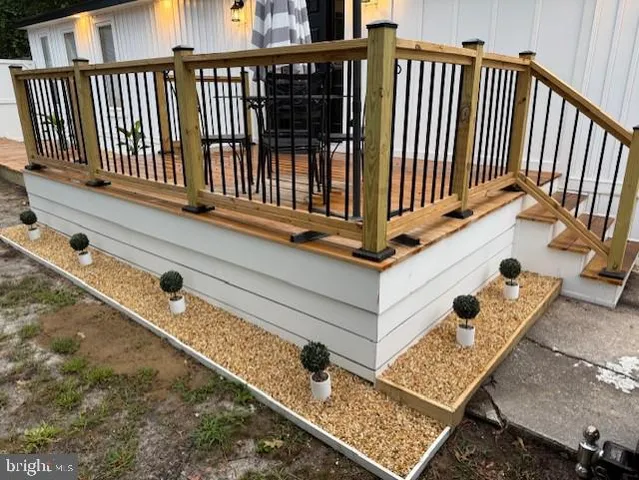 a view of entryway with wooden floor and stairs