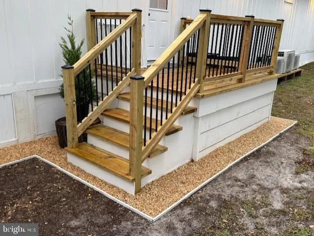 a view of a house with backyard and wooden floor