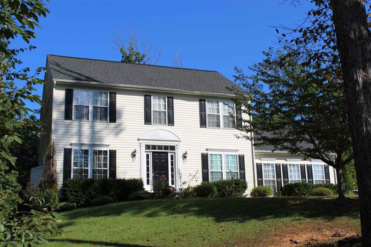 625 Reedy Creek Road Louisa, VA 23093 - Photo 1 of 5 a front view of a house with garden and trees