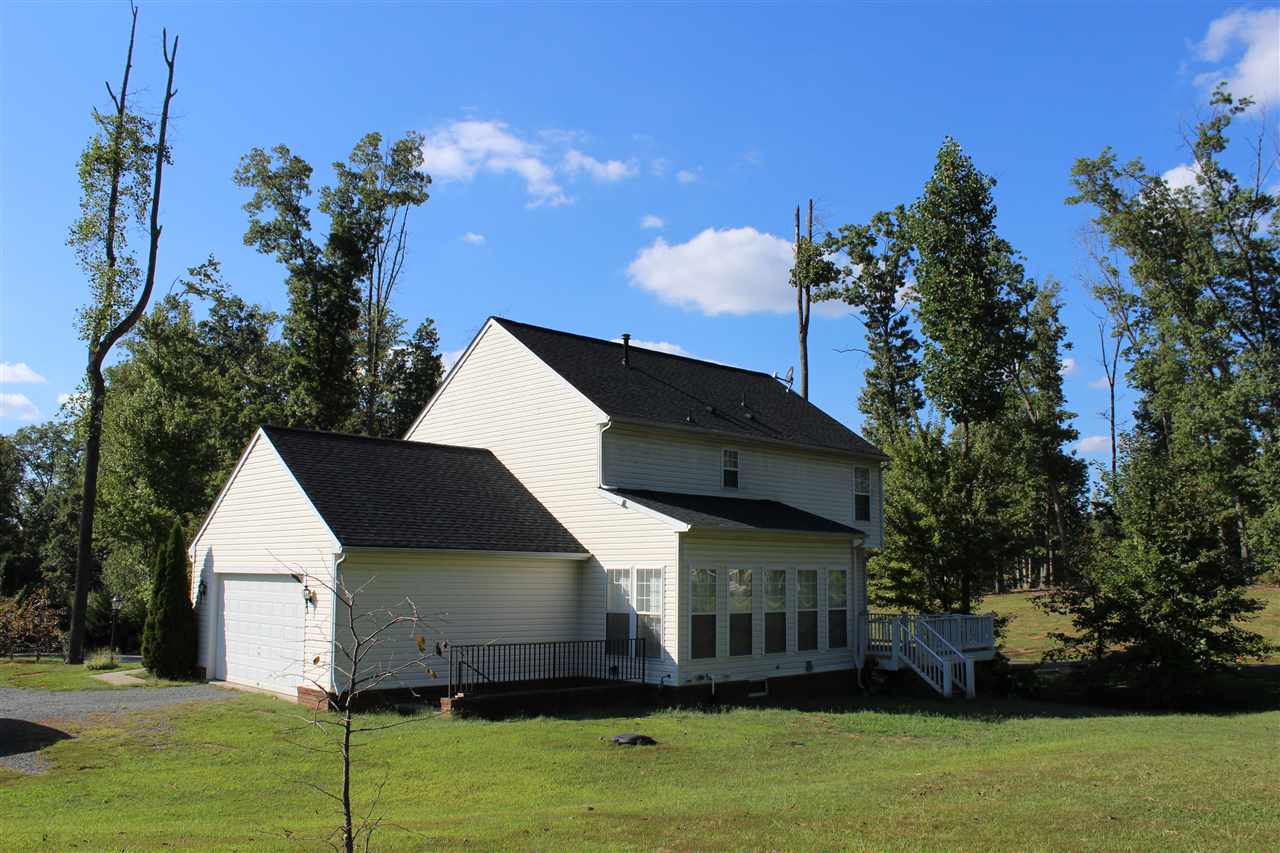 625 Reedy Creek Road Louisa, VA 23093 - Photo 4 of 5 a view of house with garden space and swimming pool