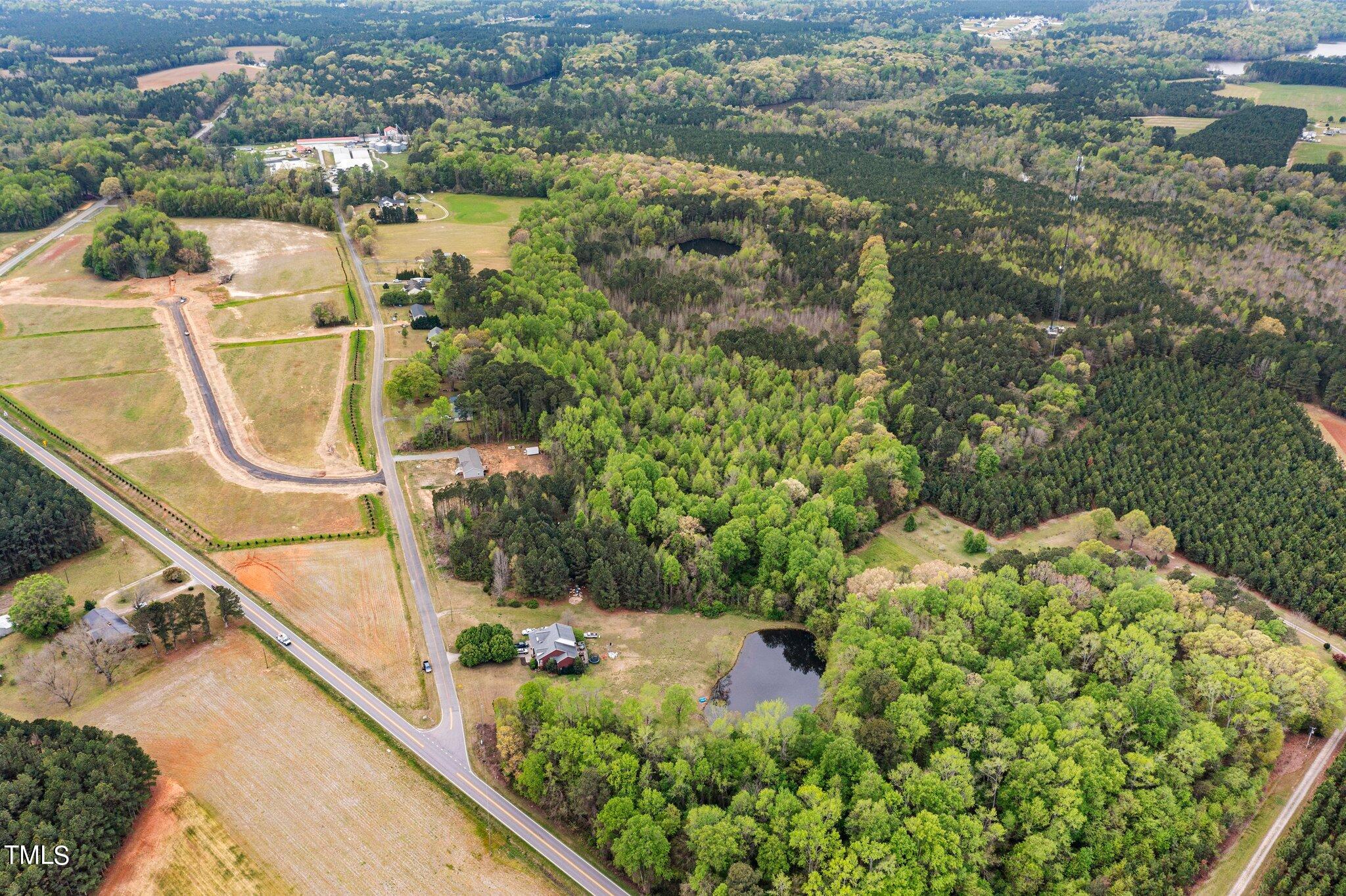 0 Atkinson Mill Road Middlesex, NC 27557 - Photo 7 of 12 view of a lake with a houses
