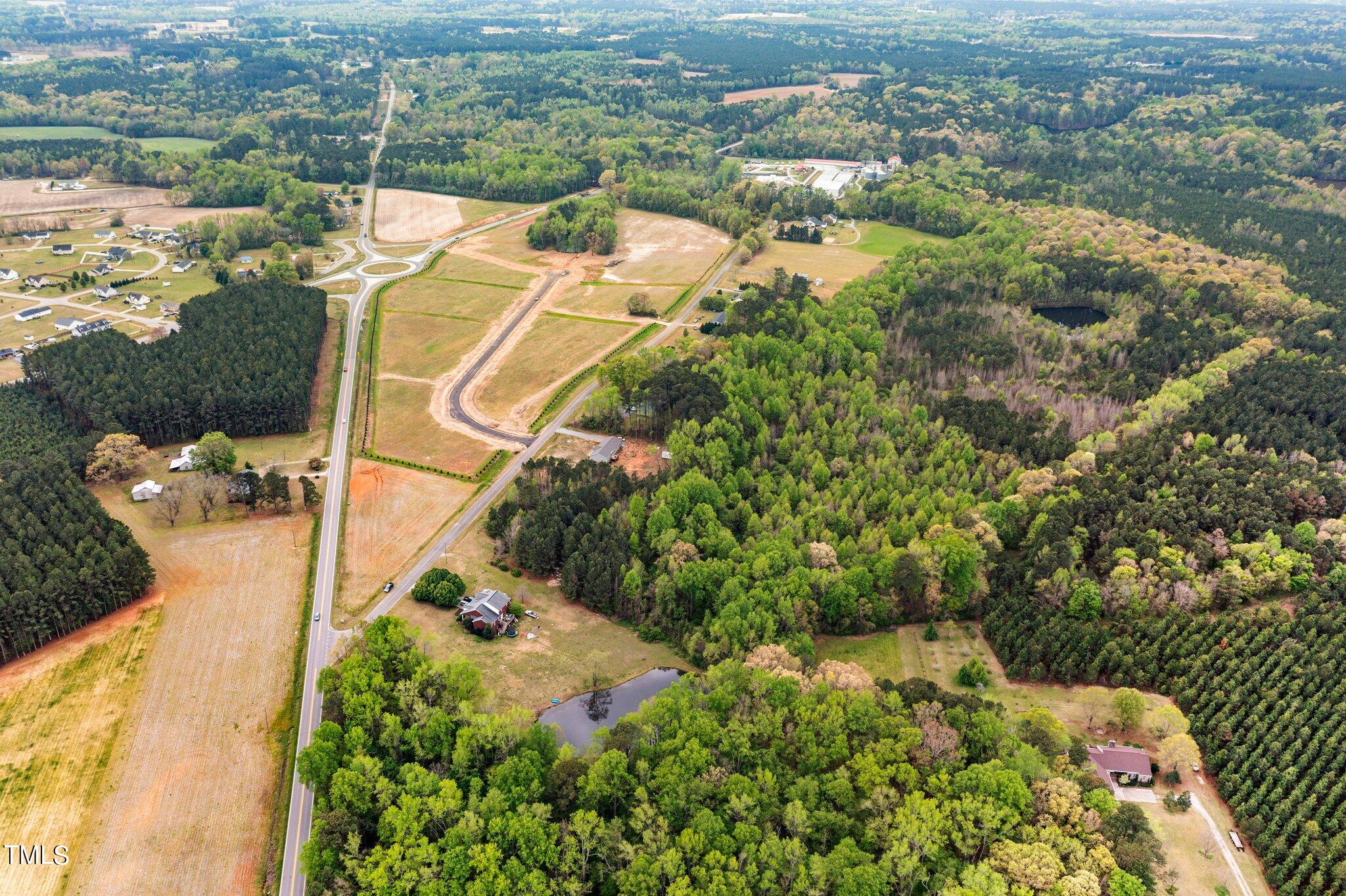 0 Atkinson Mill Road Middlesex, NC 27557 - Photo 8 of 12 an aerial view of a house with a yard and lake view