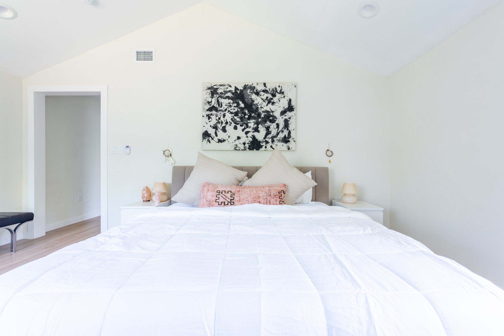 7304 Geneva Drive Austin, TX 78723 - Photo 13 of 39 a bedroom with a bed and a painting on the wall