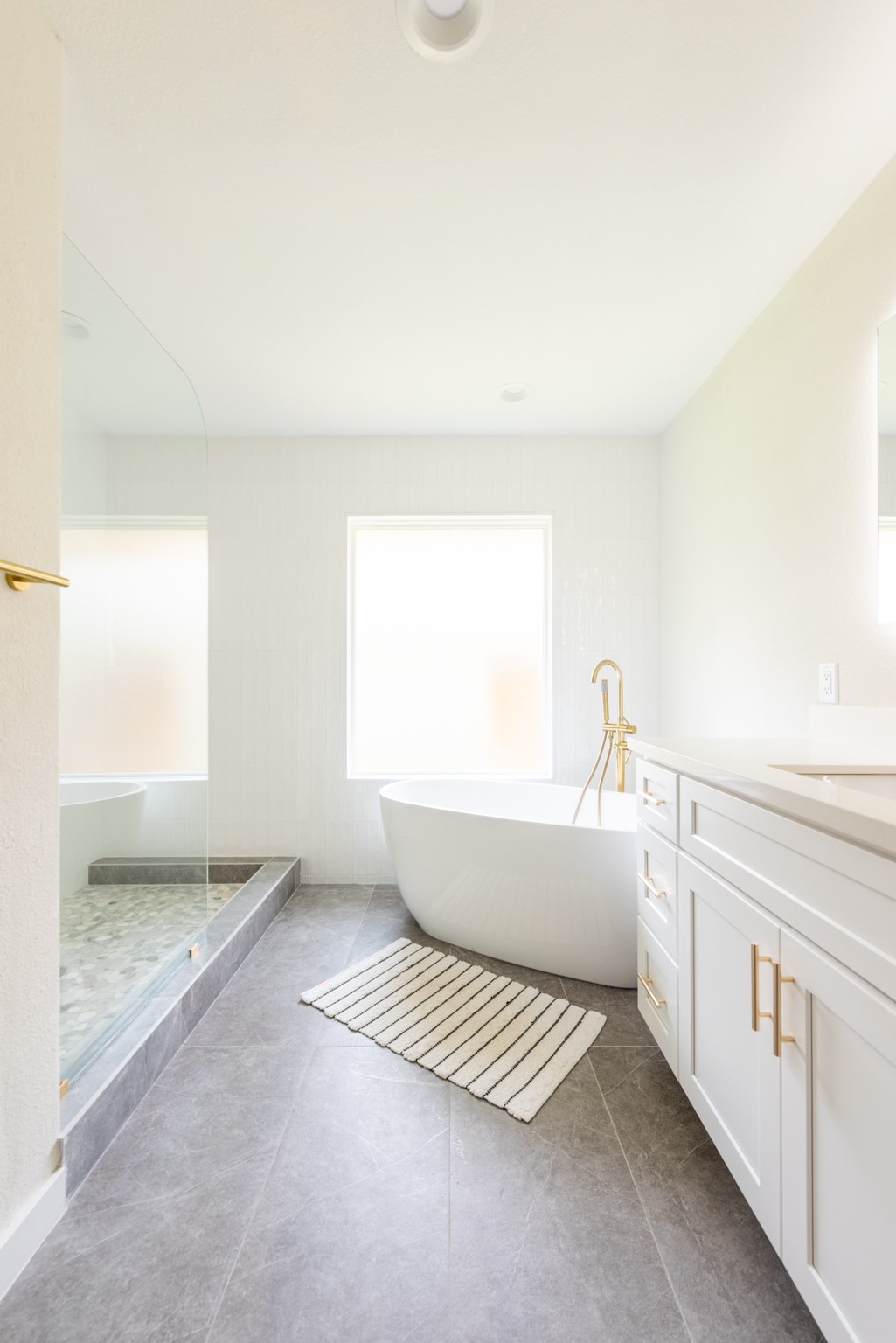 7304 Geneva Drive Austin, TX 78723 - Photo 18 of 39 a bathroom with a bathtub and a window