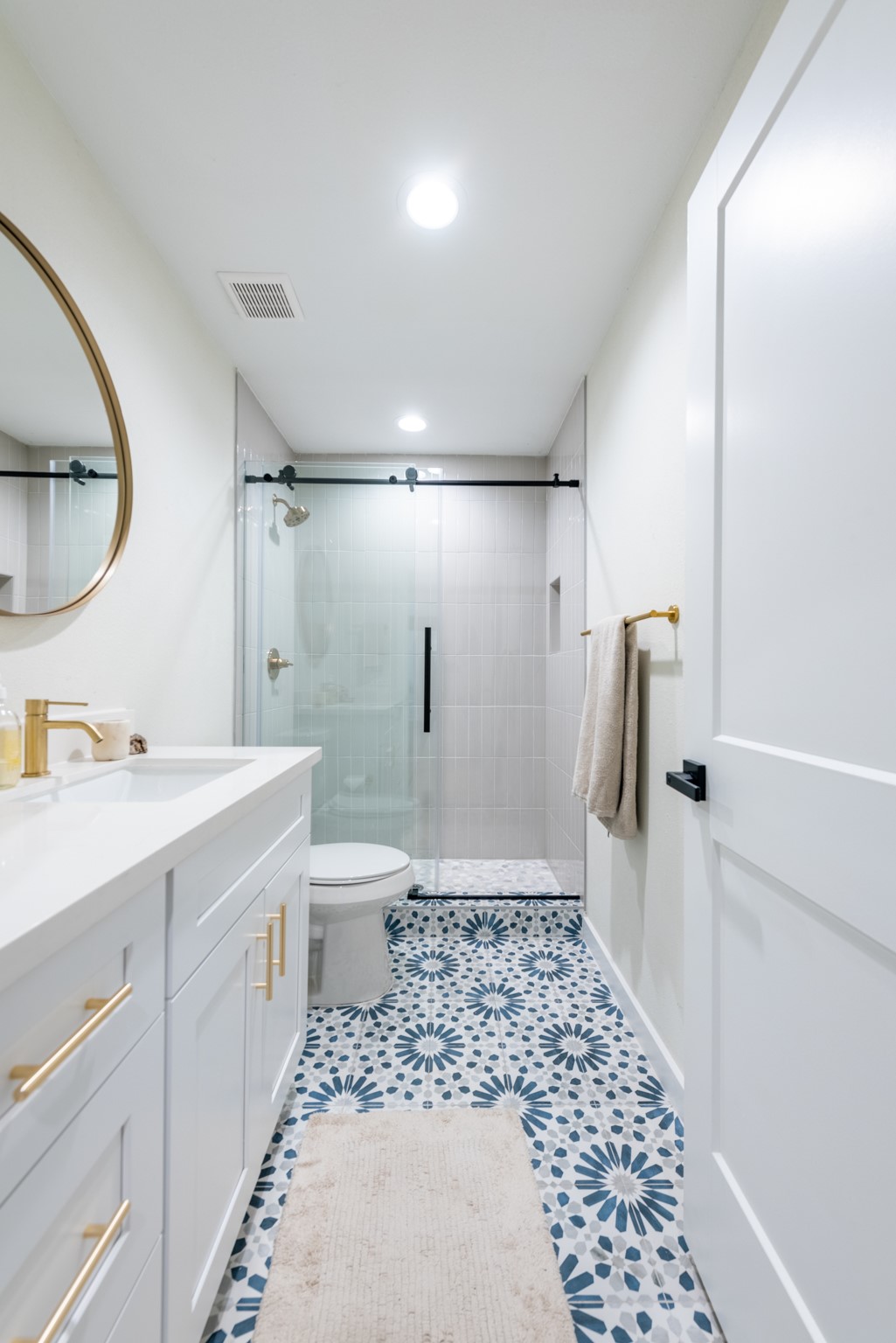 7304 Geneva Drive Austin, TX 78723 - Photo 24 of 39 a bathroom with a sink a toilet and shower