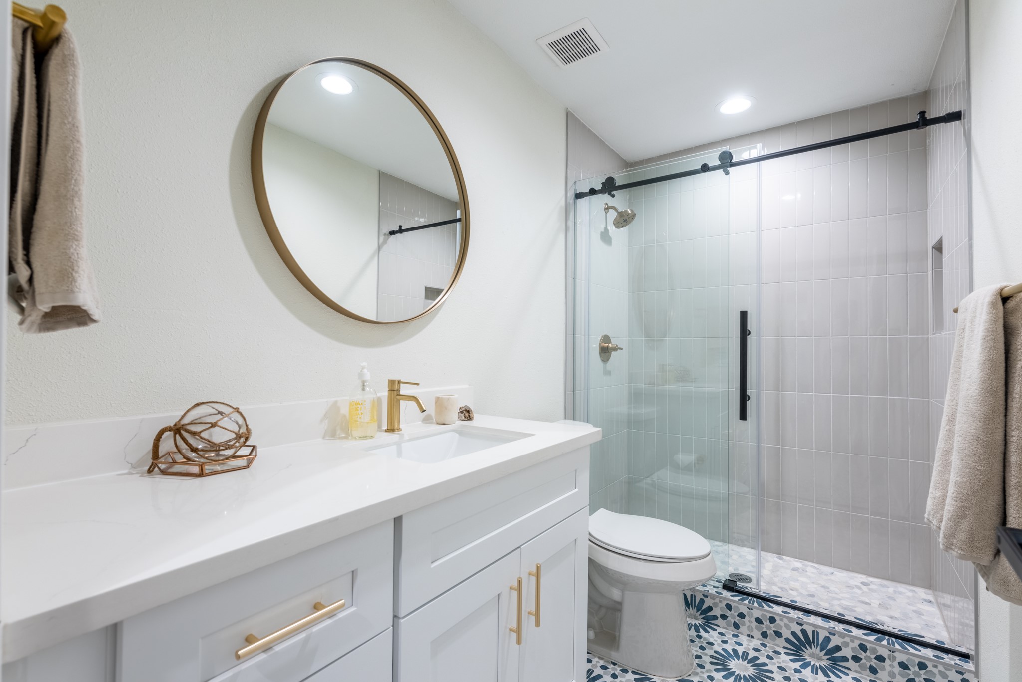 7304 Geneva Drive Austin, TX 78723 - Photo 25 of 39 a bathroom with a sink a toilet and a mirror