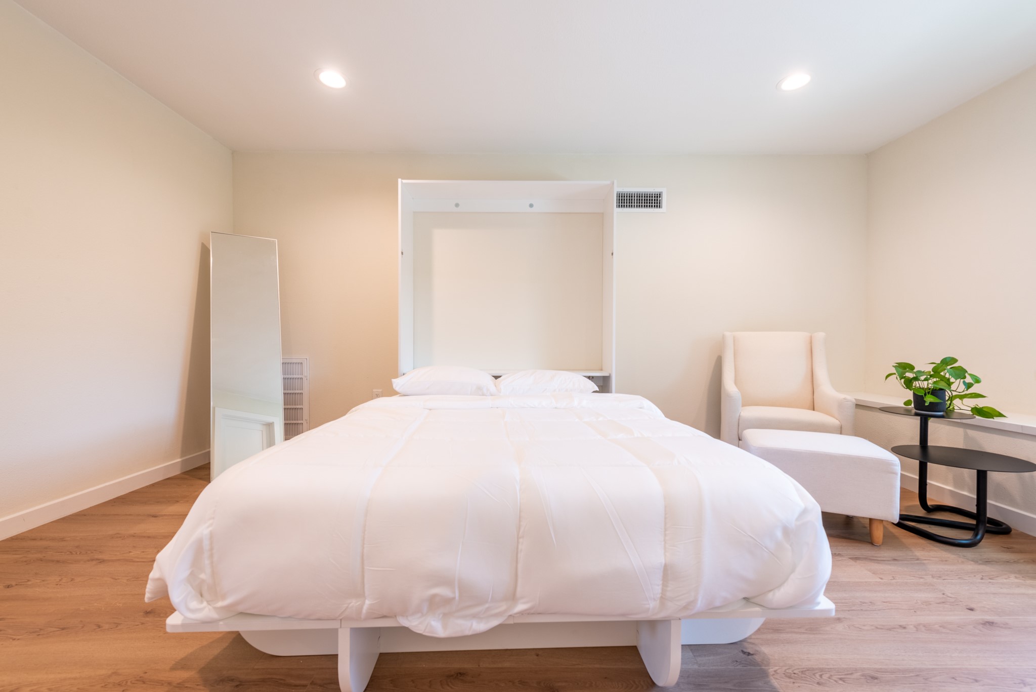 7304 Geneva Drive Austin, TX 78723 - Photo 26 of 39 a large white bed in a white room
