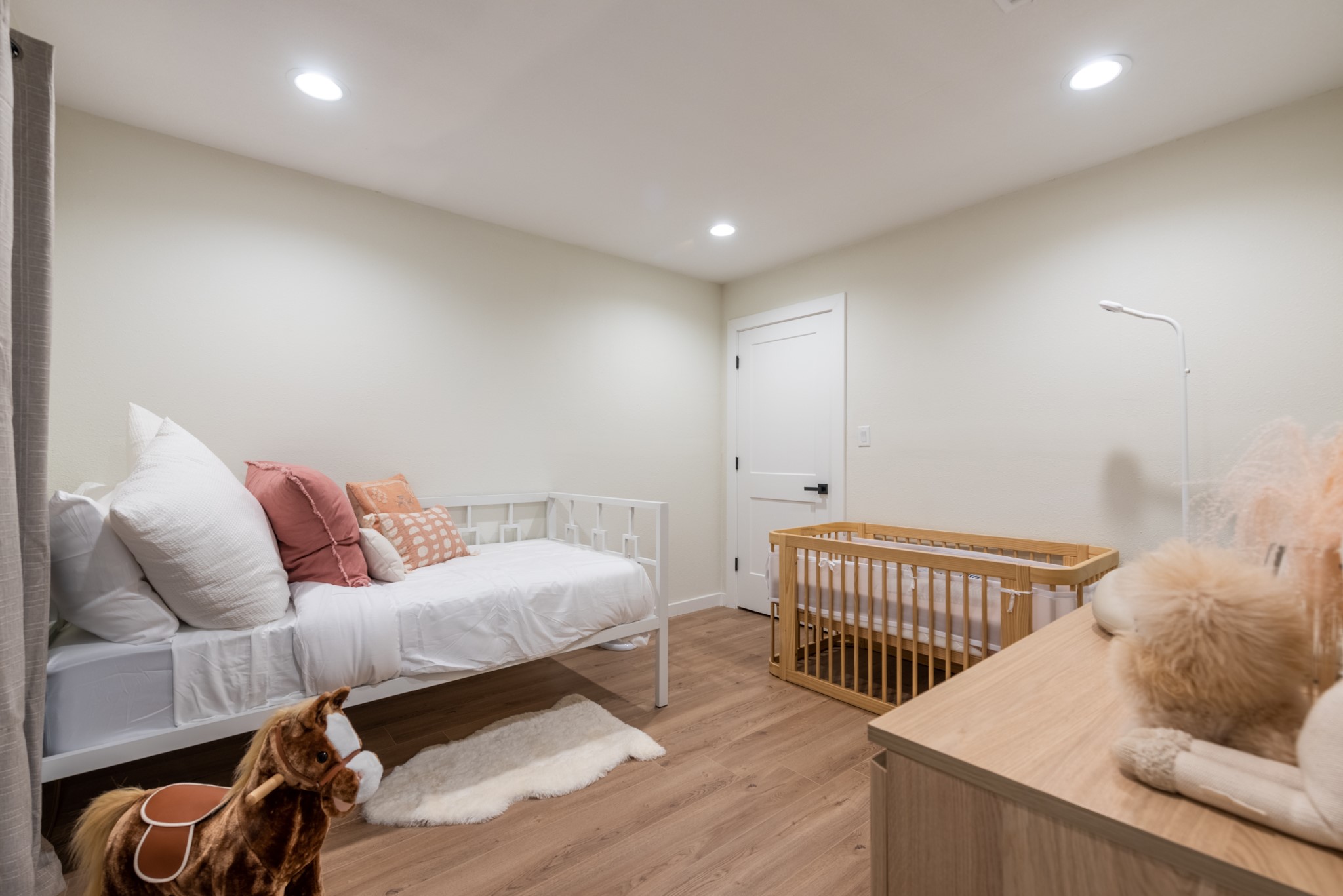 7304 Geneva Drive Austin, TX 78723 - Photo 29 of 39 a bedroom with furniture and a wooden floor