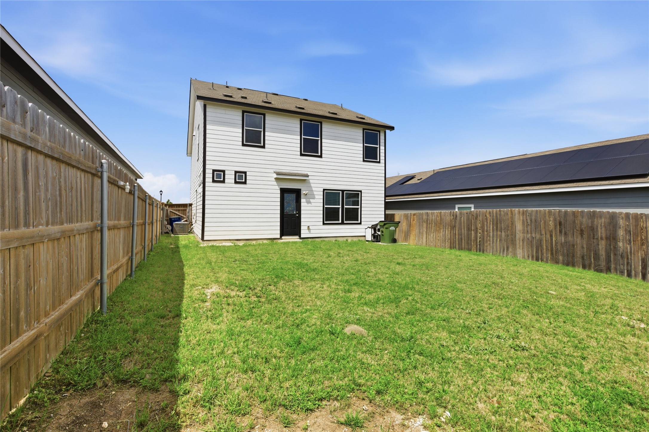 116 Night Riders Way Jarrell, TX 76537 - Photo 33 of 40 Spacious backyard featuring a manicured lawn and wooden privacy fencing