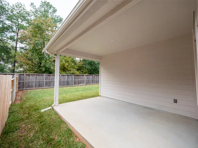 a view of a backyard with green space