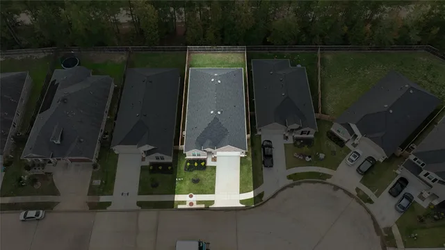 an aerial view of a house having yard